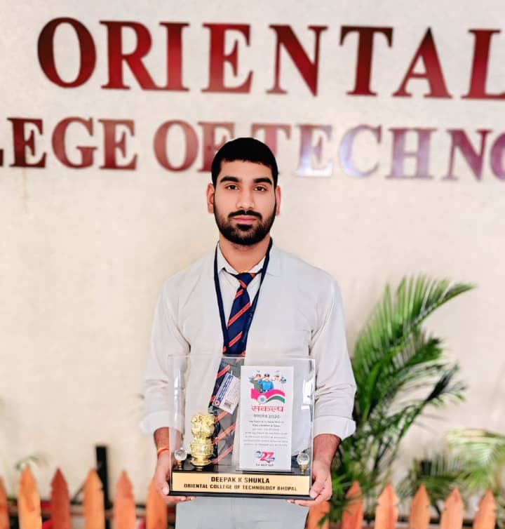 Deepak receiving a college achievement award at Oriental College of Technology
